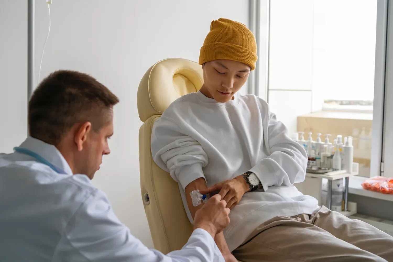 сalm clinical setting with a patient receiving IV ketamine infusion, monitored by a healthcare professional