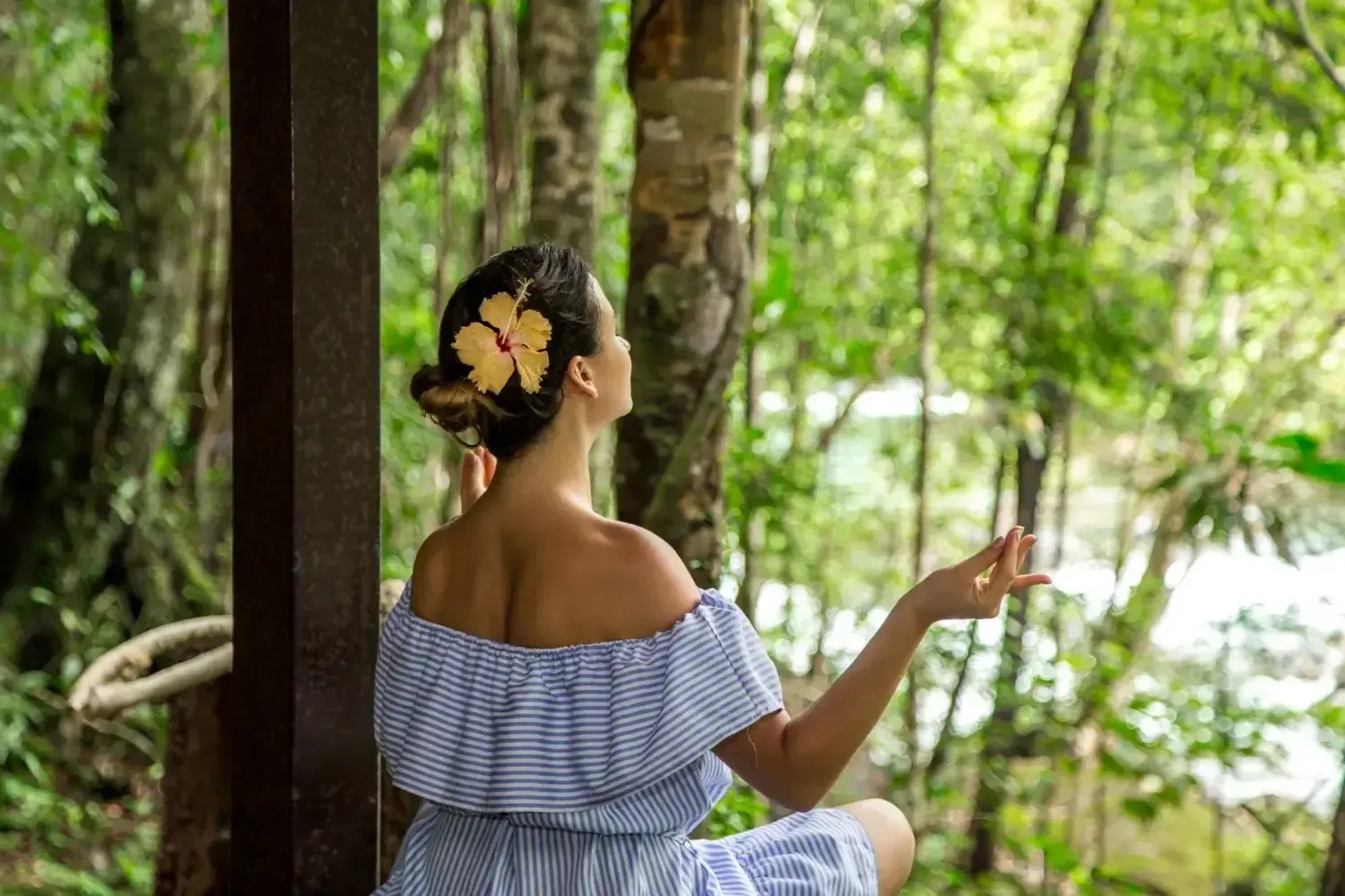 wellness tourist relaxing at a luxury thai retreat, featuring serene tropical landscapes